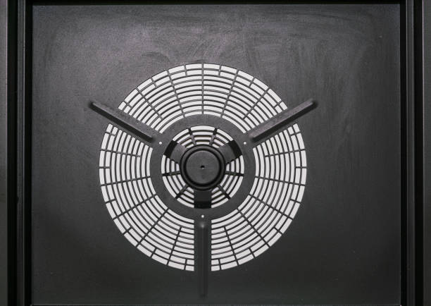 Air compressor housing.Round metal grille