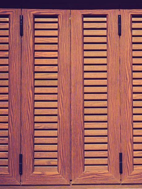 istock Traditional brown shutters window, Greece 1195733302