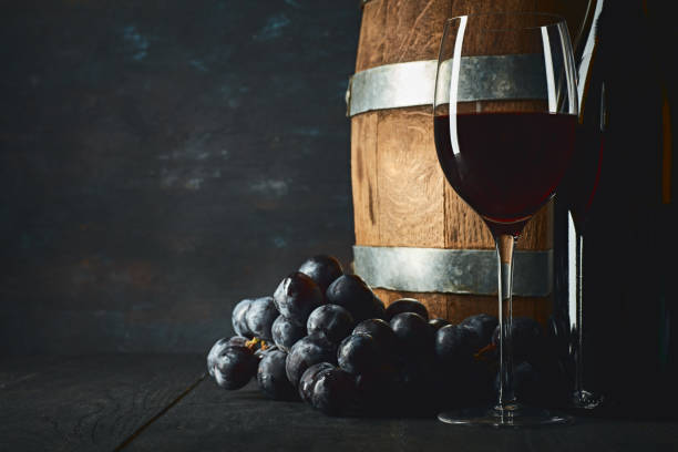 Glass of white wine on a barrel