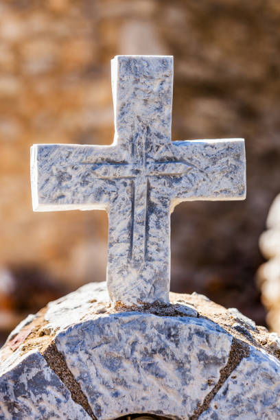 istock Greek stone cross on burial ground 1195733558