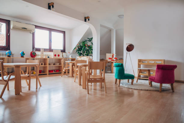 istock Tables and chairs in modern preschool classroom 1195735163