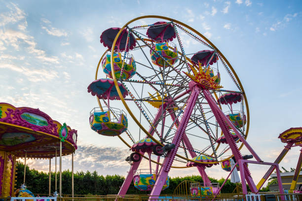 istock Rotating Russian wheel amusement ride in the summer 1195735932