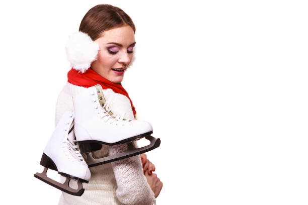 istock Smiling woman with ice skates 1195738809