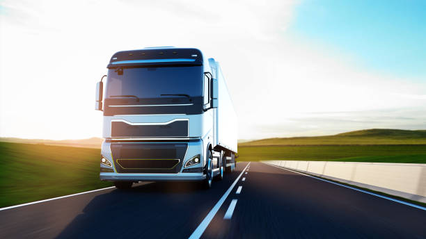 istock semi-truck with trailer driving on road 1195739246