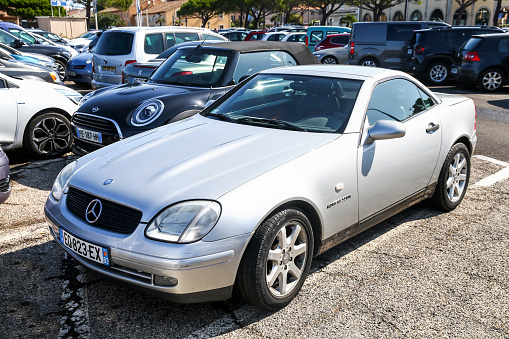 Saint-Tropez, France - September 11, 2019: Convertible cabriolet car Mercedes-Benz SLK-class (R170) in the city street.