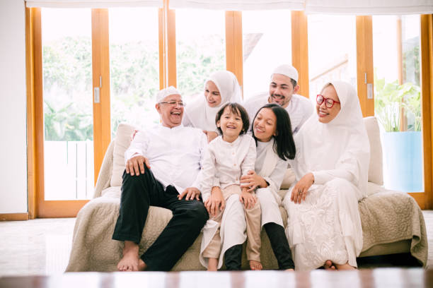 Photo of Lovely Family Celebrating Hari Raya Aidilfitri Hari Raya Aidilfitri/Idul Fitri Celebration hijab photos stock pictures, royalty-free photos & images