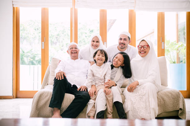 Photo of Lovely Family Celebrating Hari Raya Aidilfitri Hari Raya Aidilfitri/Idul Fitri Celebration malay stock pictures, royalty-free photos & images