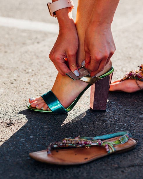 istock Girl changing shoes. 1195742598