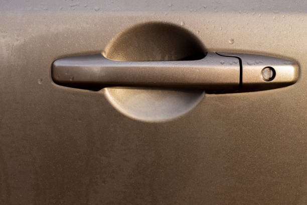 A car door handle with lock creates a gentle geometric look to this copy space