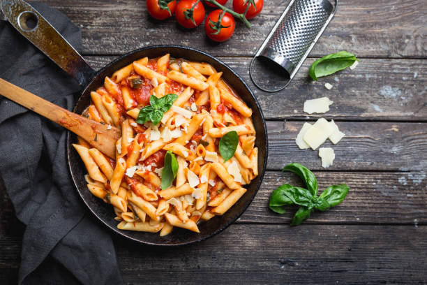 istock Penne pasta in tomato sauce 1195745580