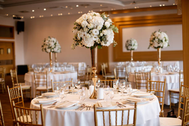 istock Wedding banquet tables with flowers decoration 1195746384
