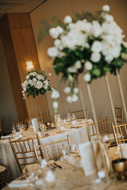 istock Wedding banquet tables with flowers decoration 1195746388