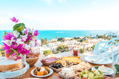istock Breakfast on the beach at hotel or resort by the sea in summer season. Holiday and vacation breakfast image.	Traditional Turkish or Greek breakfast at bodrum town beach in Turkey or Greece 1195749434