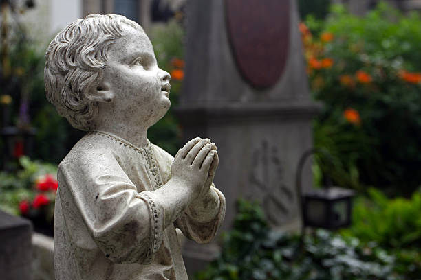a statue on the cemetary in  berlin, germany<br>