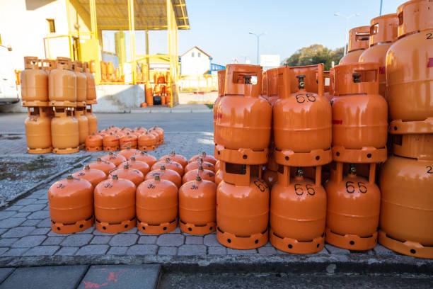 istock Orange LPG tanks arranged outdoor 1195754187