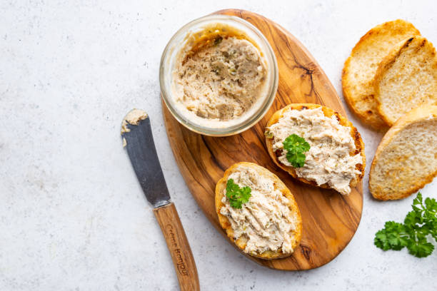 Sandwiches with salmon pate Sandwiches with salmon pate and baguette, fish bruschetta, top view. Rustic homemade Italian cuisine. smoked food stock pictures, royalty-free photos & images