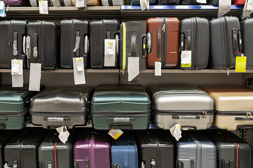 A set of suitcases on the shelves in the store
