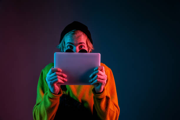 istock Caucasian man's portrait isolated on gradient studio background in neon light 1195758251