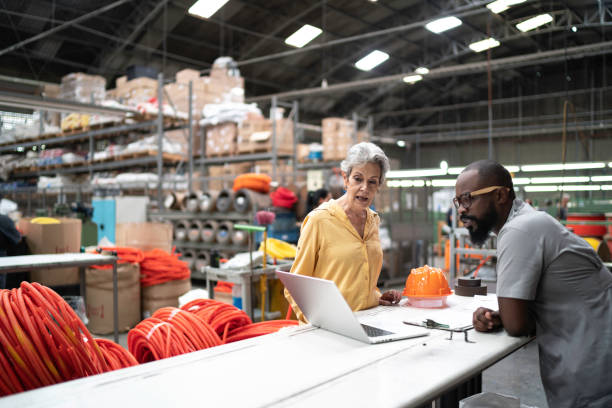 istock Colleagues working in industry and using laptop 1195758495