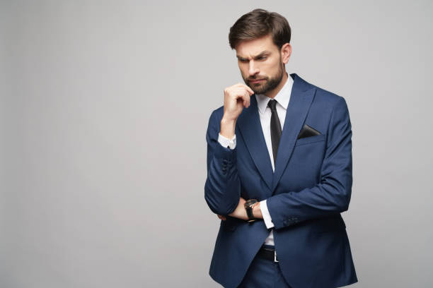 istock Studuo shot of thinking businessman wearing suit 1195759509