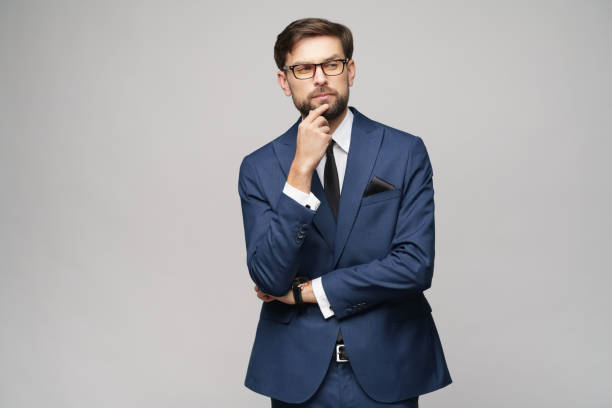 istock Studuo shot of thinking businessman wearing suit 1195759573