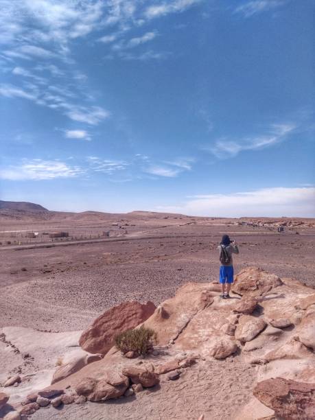istock Man at Rainbow Valley - Rainbow Valley, San Pedro de Atacama, Chile 1195762478