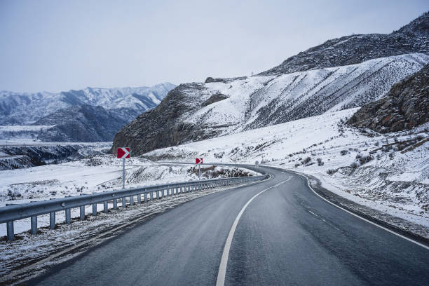 istock Winter road in mountains. Snow. 1195762514