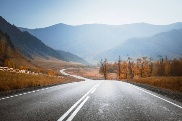 istock Country road in mountains. Autumn. 1195762839