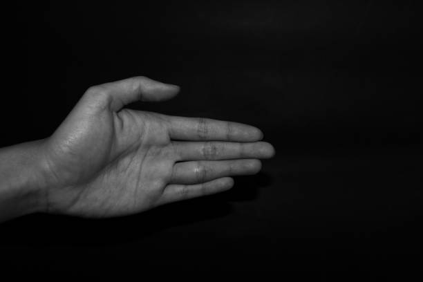 istock Monochrome hand gestures on black background 1195763488