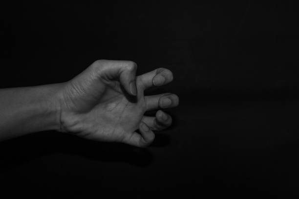 istock Monochrome hand gestures on black background 1195763497
