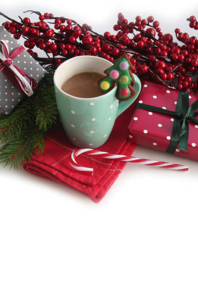 istock Christmas cookie in shape of a Christmas tree on a coffee cup on white 1195763502