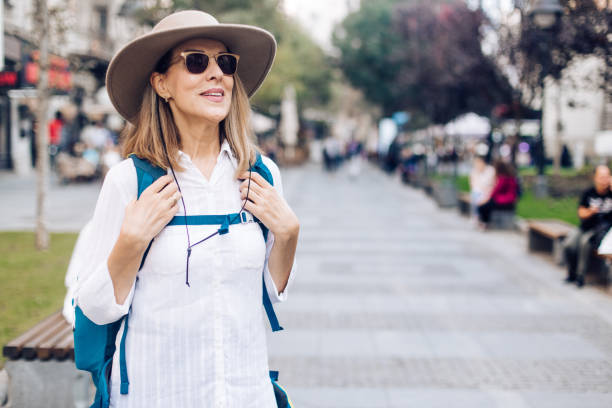 istock Woman wearing hat and sunglasses 1195764761