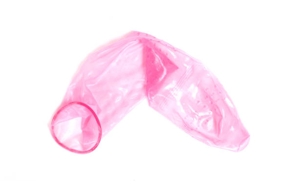 istock Red condom, isolated on a white background 1195766826