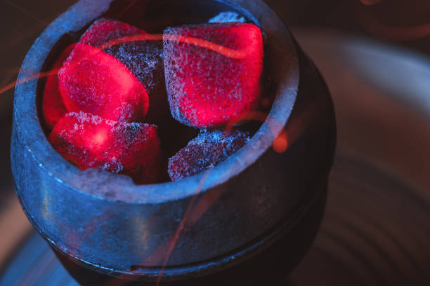 istock Hookah hot coals for smoking. flying sparks. 1195766957