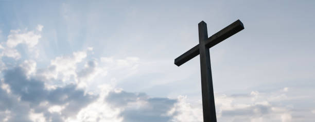 istock Wooden cross over sunrise background 1195767608