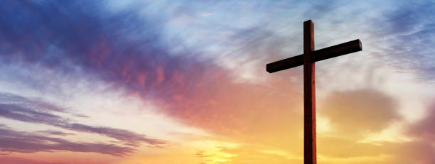 istock Cross of Jesus Christ empty over dramatic sunrise sky panorama with sclouds.  Easter concept 1195767780
