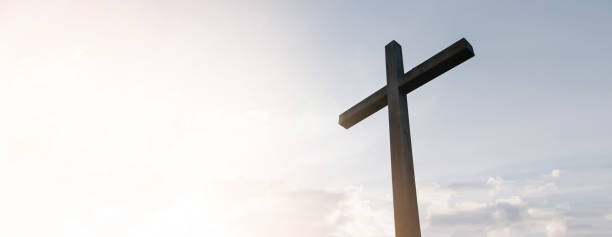 istock Wooden cross over sunrise background 1195768120