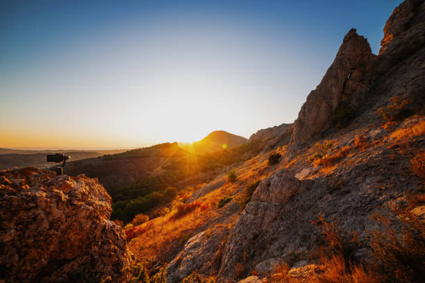 istock Shooting videos on a mobile phone with 3D stabilizers in the mountains 1195770122