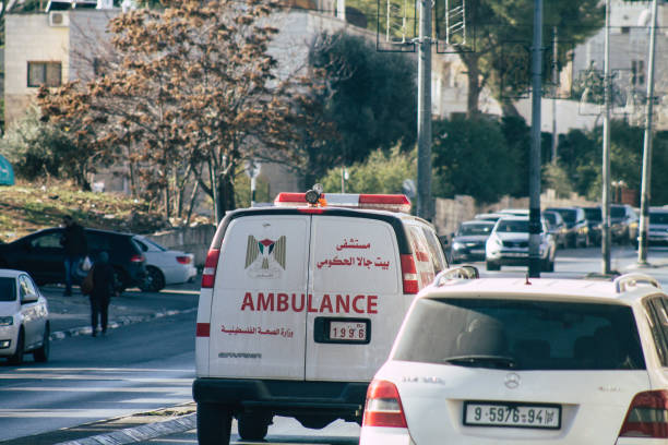 colors of Palestine Palestinian Territory Bethlehem December 16, 2019 View of a Palestinian  ambulance in the streets of Bethlehem in the afternoon ambulance in israel stock pictures, royalty-free photos & images