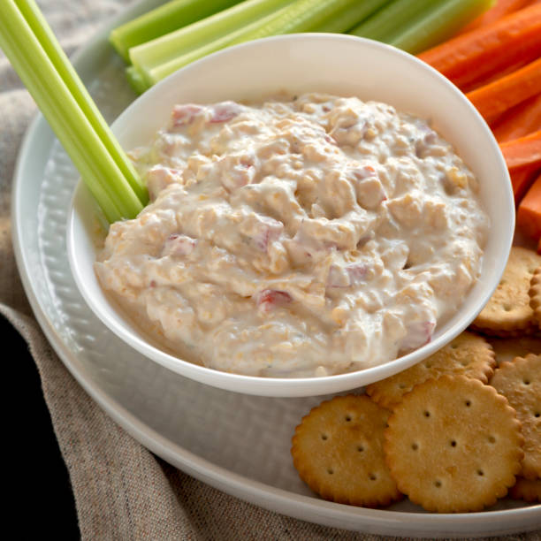 istock Homemade Southern Pimento Cheese Dip with carrots, celery and crackers, low angle view. Close-up. 1195771714