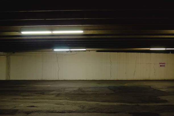 istock The dark dim parking garage at night 1195772914