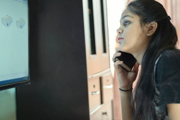 istock young girl working on computer at home 1195776233