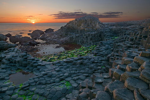 Sunset over basalt columns Giant's Causeway, County Antrim, Northern Ireland