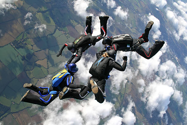 istock Four skydivers just after they jumped from a plane 119578384