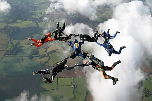 Photo of Nine skydivers in freefall