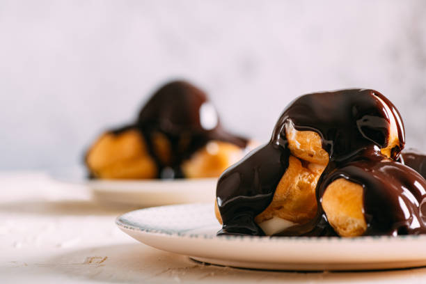 Delicious Profiterole Delicious Profiterole choux pastry photos stock pictures, royalty-free photos & images