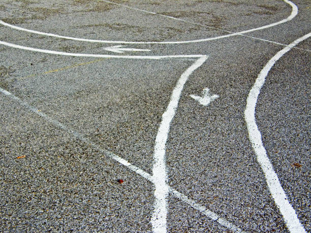 istock Splitting a track drawn on paved playground for children 1195787413