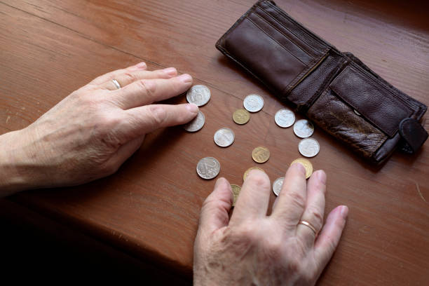 istock Old man's hands, count money. 1195792639
