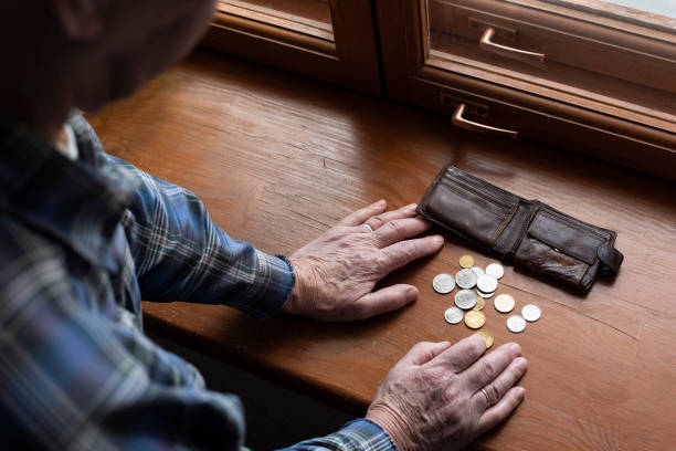 Old man's hands, count money. The concept of poverty, low income, austerity in old age. budget cut stock pictures, royalty-free photos & images