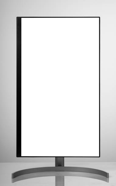 istock Modern monitor on white table and light background. 1195792792